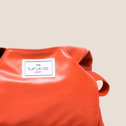Monochrome Orange Leather Full Size Flat Lay Makeup Bag